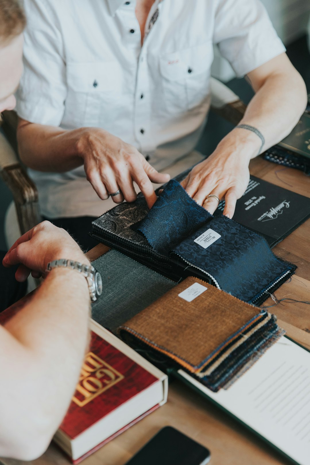 person-in-white-button-up-shirt-holding-black-paper-9zoqlrtqevi