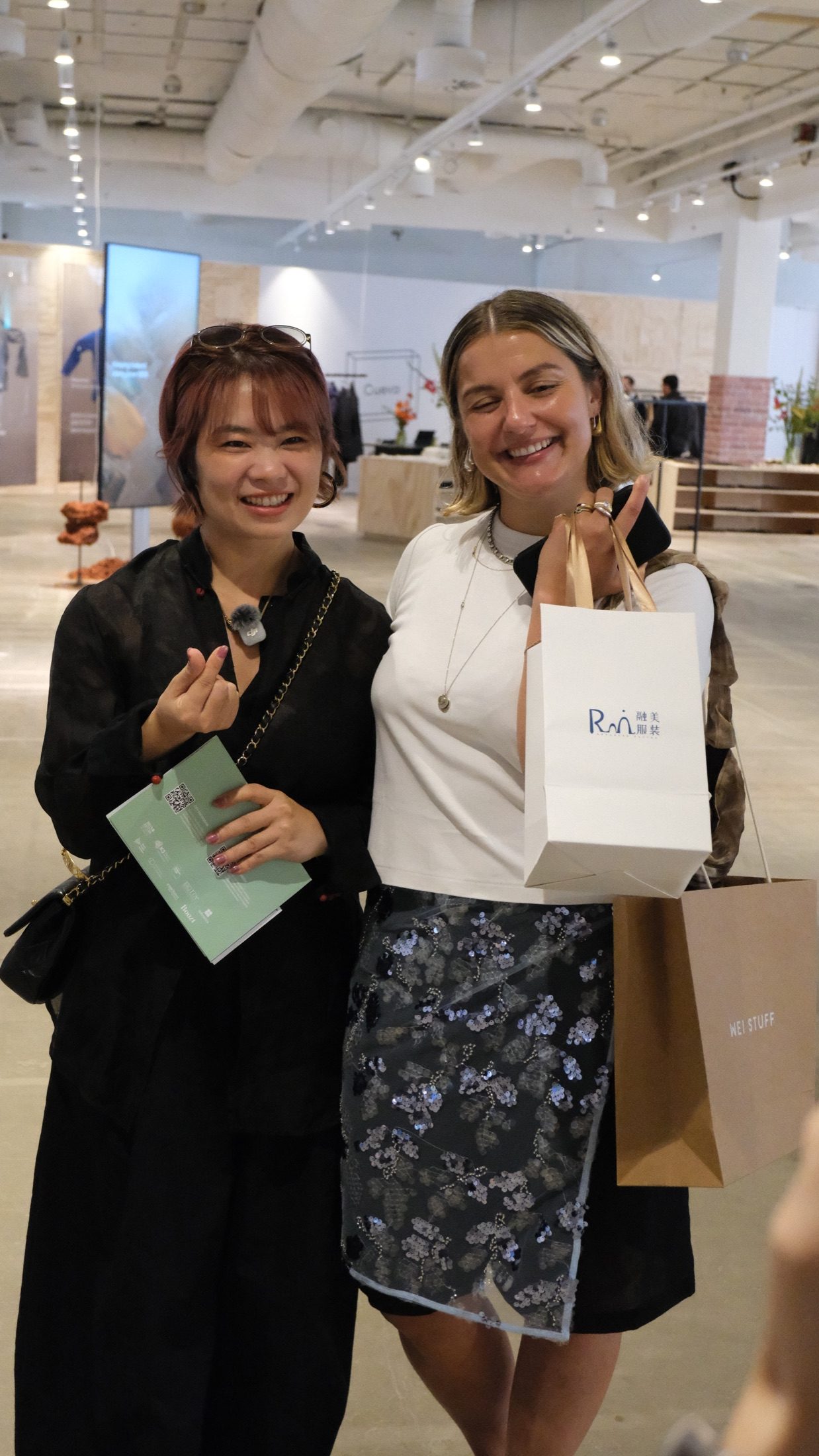 Chinese buyer presenting a company gift to CIFF international buyer host Kate